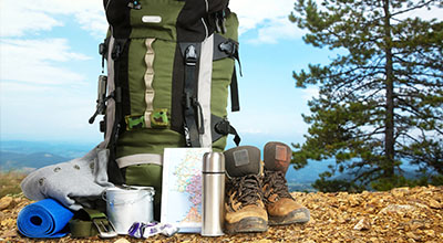 backpacking gear on a mountain hill