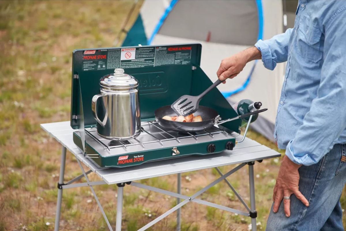 https://www.sportsmans.com/medias/camping-stove-main.jpg?context=bWFzdGVyfGltYWdlc3wxODYzNTl8aW1hZ2UvanBlZ3xoMmQvaDliLzExMTE3NTg2ODQxNjMwL2NhbXBpbmctc3RvdmUtbWFpbi5qcGd8MDYxYTMxNTJmZTVhYTJmNjM0MTNhNWM5MDgyNTFkYTNiZjg4NDYyNDE5MzU0NjA5ZGM4ODlkMDI4OWY0M2IxYQ