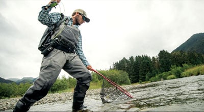 Man fishing with wading boots on