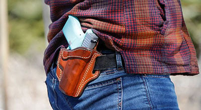 Concealed carry gun in womans back pocket