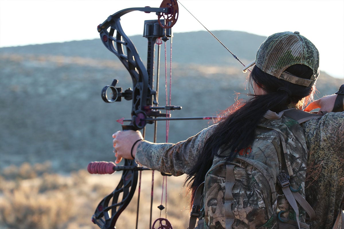 Woman with compound bow