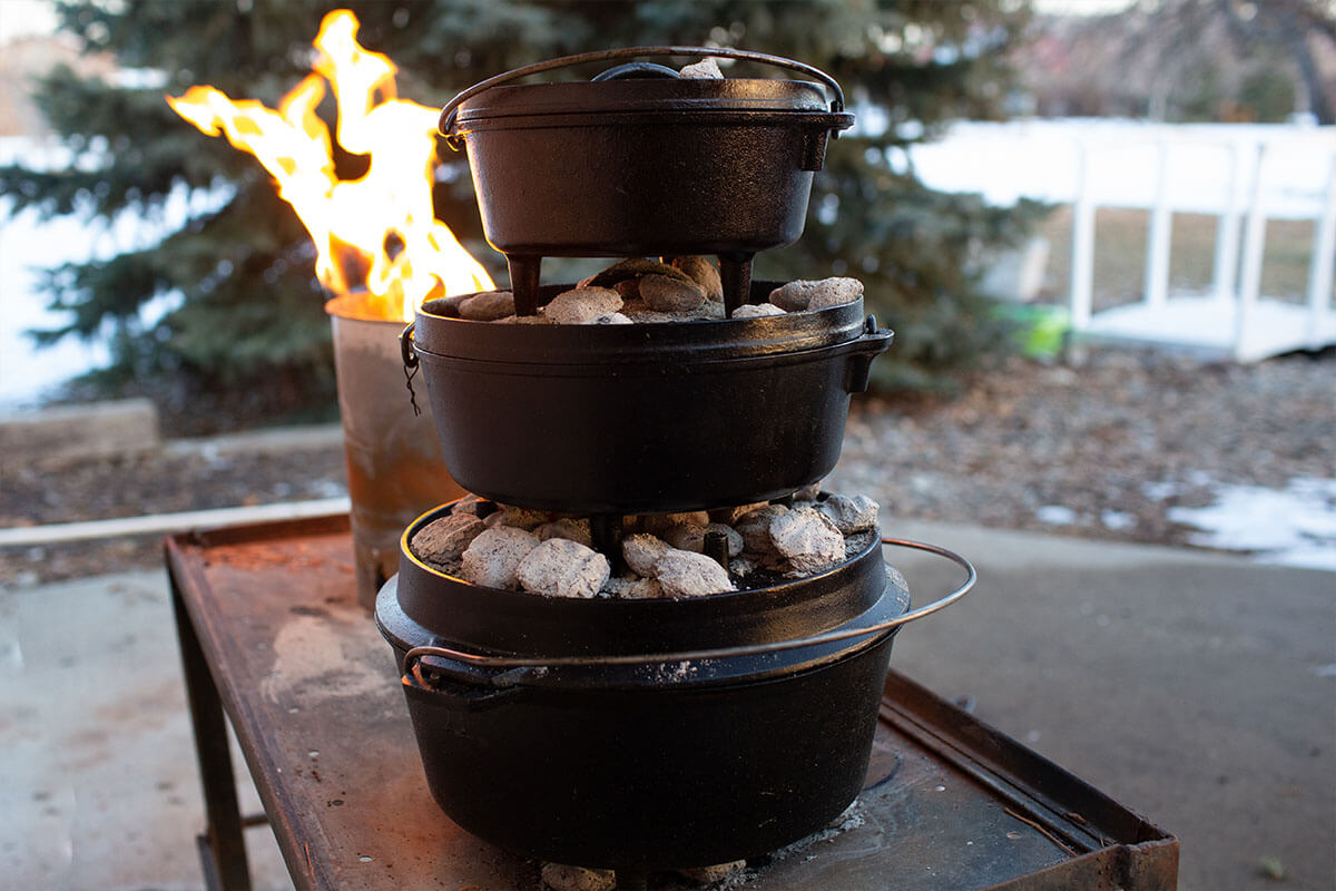 Dutch ovens different sizes cooking stacked