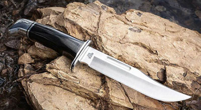 Fixed blade knife on a rock