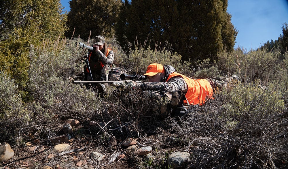 elk hunter lying down