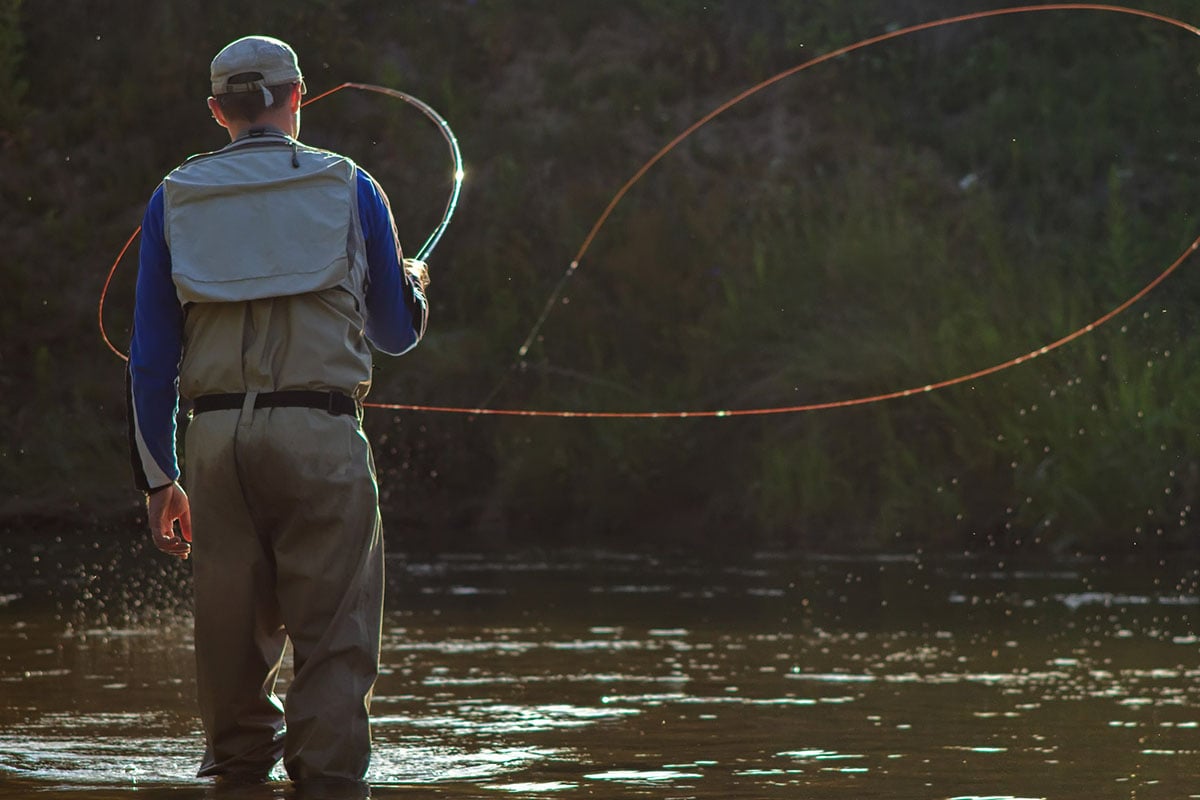 Man casting a fly fishing rod