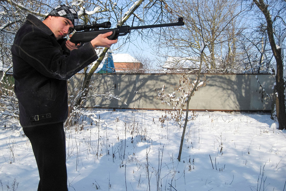 young man with air rifle