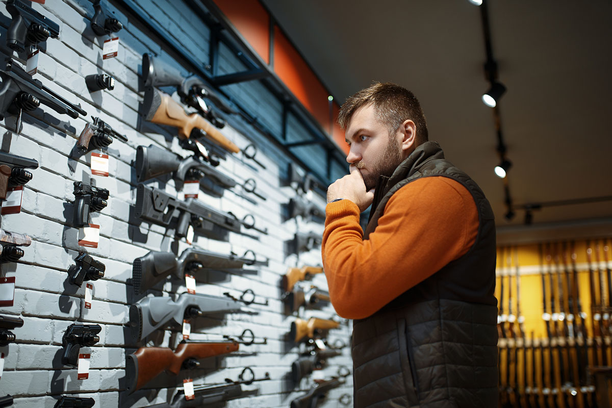man purchasing a semi-automatic shotgun