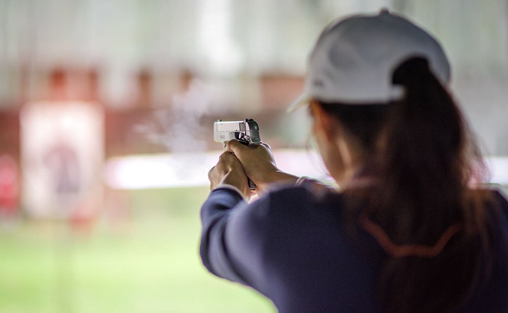 woman shooting a pistol